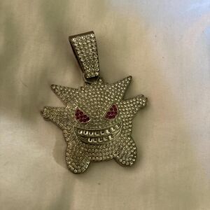Gengar Pokémon pendant with pink eyes silver colored